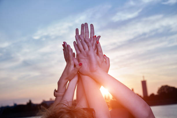 istock Friends holding hands - concept for togetherness and strength. 1278783426