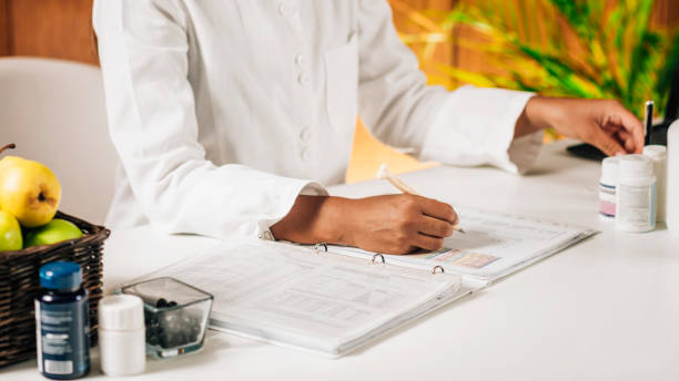 istock Functional Medicine Doctor Taking Notes for Personal Health Report 1278783501