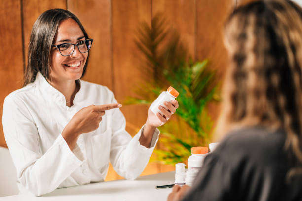 istock Functional Medicine Female Practitioner Recommending Dietary Supplement to a Client 1278784070