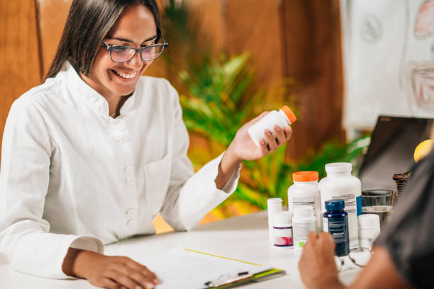 istock Functional Medicine Female Practitioner Recommending Dietary Supplement to a Client 1278784145