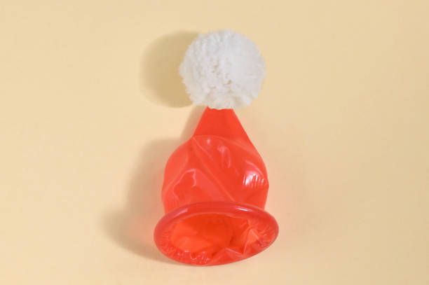 Abstract Red Condom Santa Claus Hat stock photo