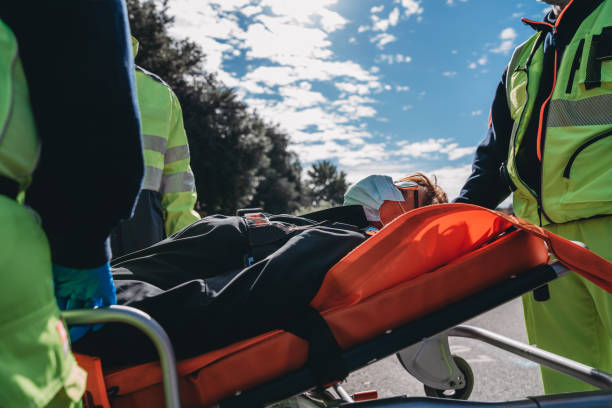 istock Ambulance staff is helping a senior lady with a stretcher 1278786357