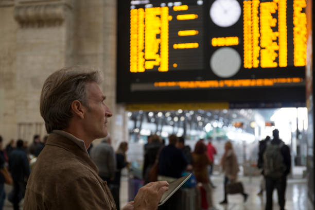 istock Man uses digital tablet in train station 1278787649