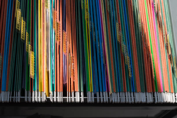 istock Colorful folders are arranged in a file cabinet. 1278789120