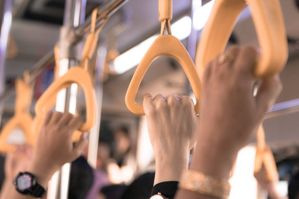 istock People hand holding handle on the bus 1278789335