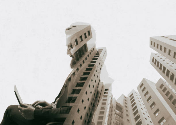 istock Bearded man with laptop and new building. 1278790768