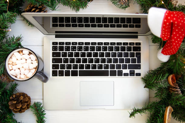 istock Laptop and coffee surrounded by christmas decorations, top view 1278790779
