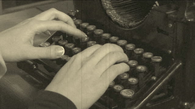 woman writing to a very old typewriter