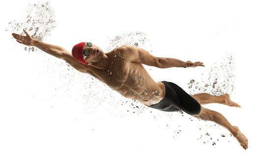 To top. Caucasian professional sportsman, swimmer training isolated on white studio background. Muscular, sportive man practicing in water sport. Concept of action, motion, youth, healthy lifestyle.