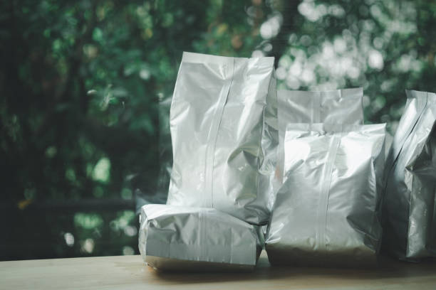 istock Packaging for coffee beans, tea and spices, snacks and berries on wood table 1278793925