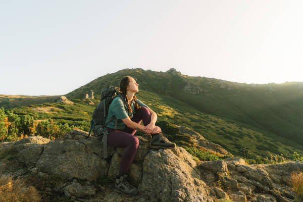 istock Woman hiking in mountains 1278794037