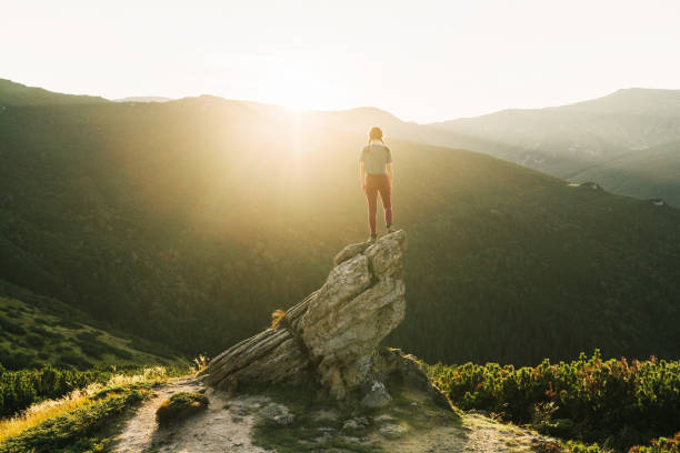 istock Woman hiking in mountains 1278795246