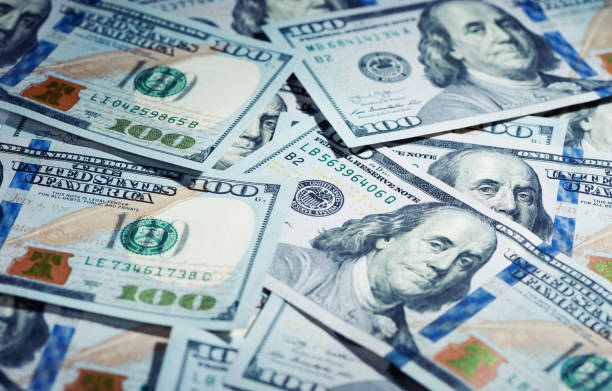 istock Heap of the one hundred dollars bills for background 1278795409