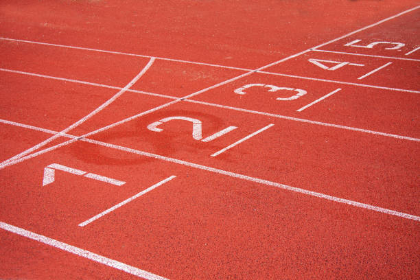 istock Athletic running track in a stadium with start point positions numbers one two, three, four five. 1278795476