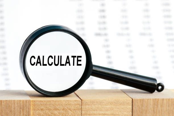 istock Look closely and Calculate with a magnifying glass , business concept image with soft focus background 1278796536