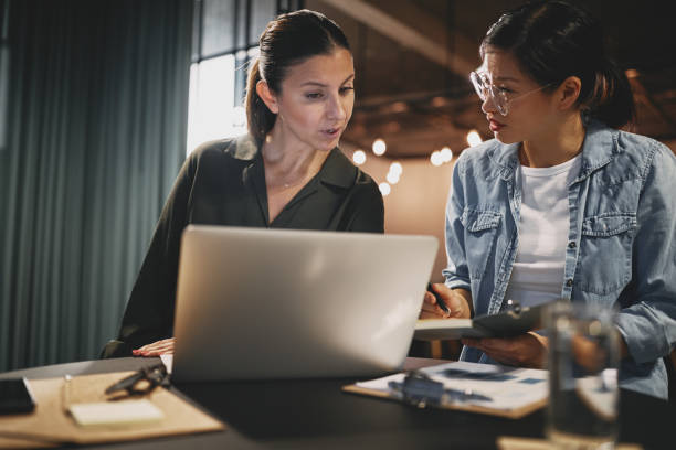 istock Diverse young businesswomen working together in an office 1278798041