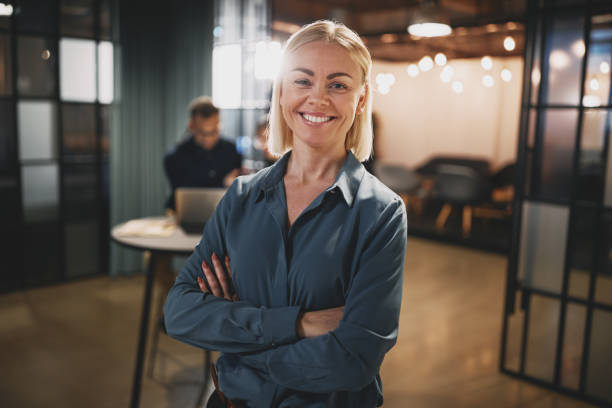 istock Young businesswoman smiling while working in an office 1278798104