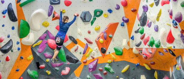istock Caucasian sportswoman training on indoor artificial climbing wall 1278798118