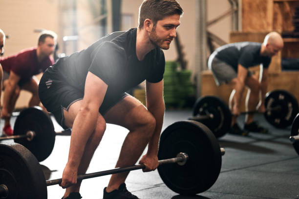 istock Fit young man ready for a gym weightlifting session 1278798636