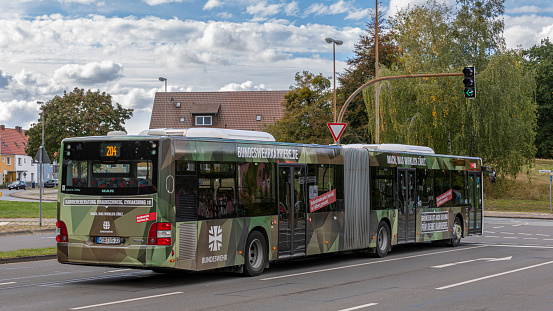 Wolfsburg, Germany - oct 5th 2020: German military is recruiting new personnel by having a city bus been painted into camouflage colour.