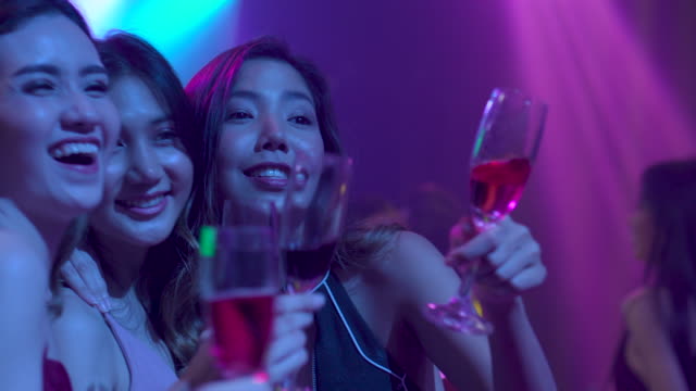 Group of Young women Dance and drink in nightclub