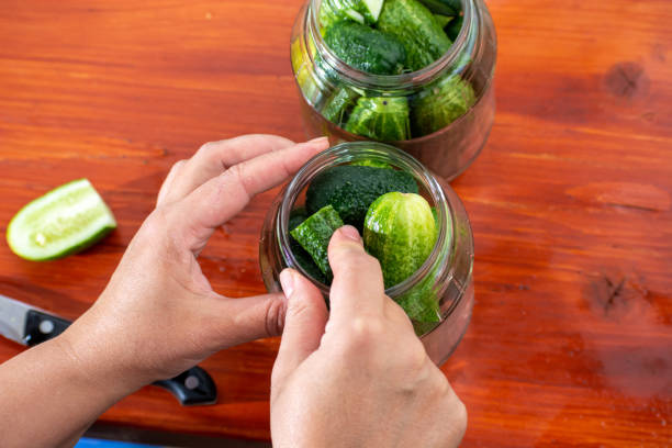 istock pickled cucumbers with mustard in a jar. Appetizer for gourmets. 1278801813