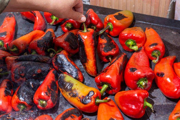 istock Red peppers roasting on a wood-fired stove 1278801854