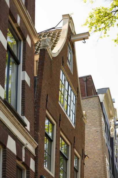 istock Antique buildings with old fashioned windows in Amsterdam. 1278802237