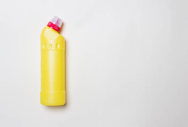 istock yellow bottle with cleaning agent on colored paper background with copy space 1278802319