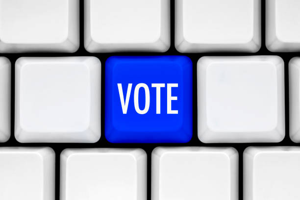 istock Vote Concept, Blue button on white keyboard. Online Voting Concept. 1278802661