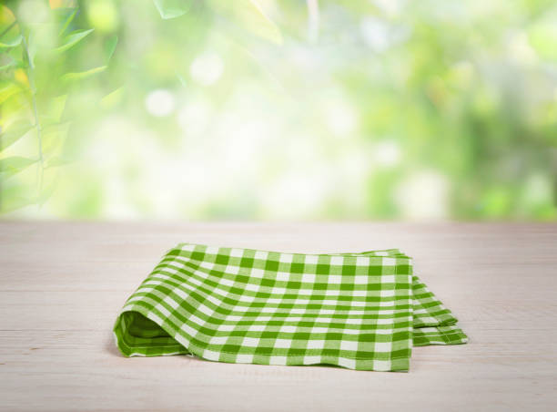 Green and white tablecloth pattern seamless background. Picnic table, covered with a checkered tablecloth. Ideal to position products on and place in the foreground of any image.