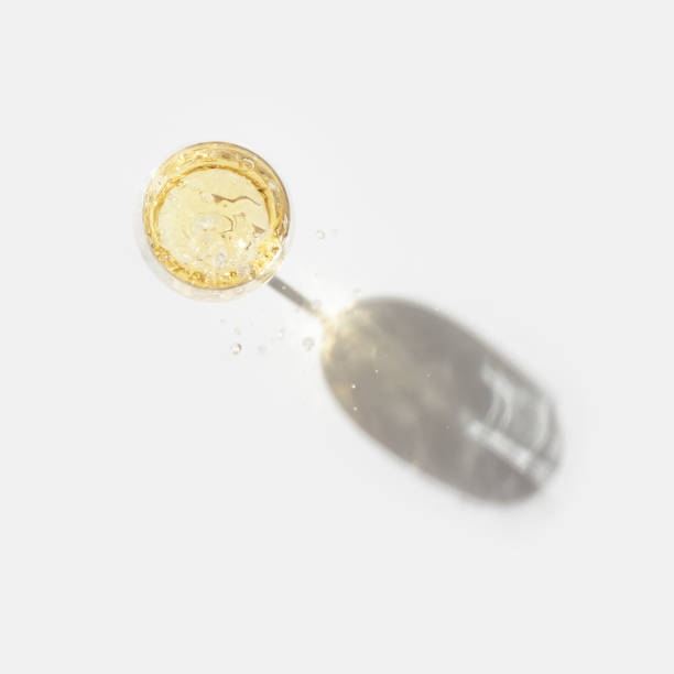 istock Splash in glass of white wine with hard shadow a 1278803735