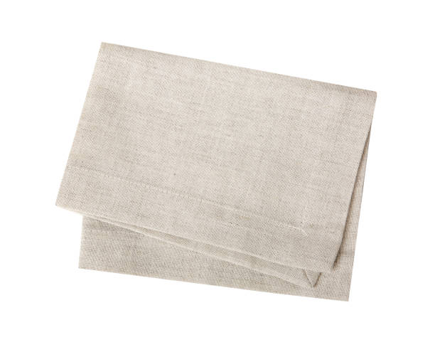 Kitchen towel isolated on white.Folded beige cloth. Kitchen towel isolated on white.Folded beige cloth.Tablecloth. dishcloth stock pictures, royalty-free photos & images