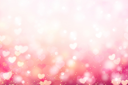 Valentine bokeh,blurred hearts backdrop.Abstract romantic background.Empty space valentine's border texture.