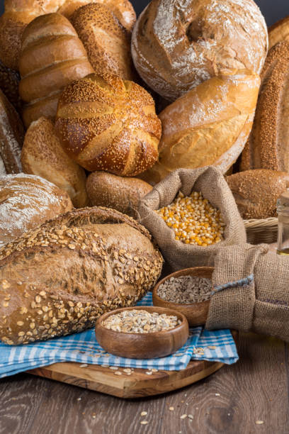 istock various types of freshly baked bread on wooden table. 1278805332