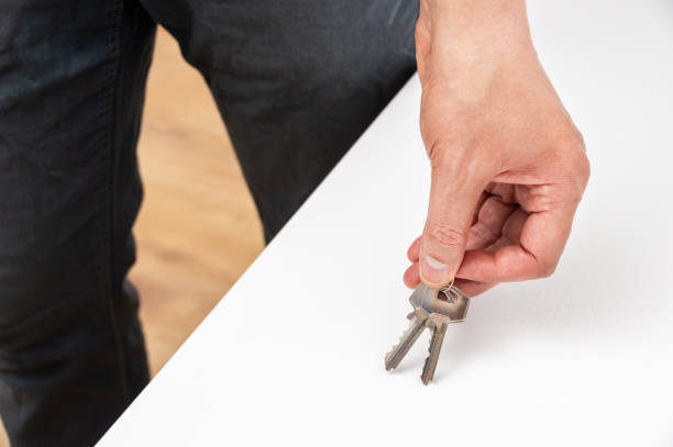 istock person holding up a keys at home 1278805568