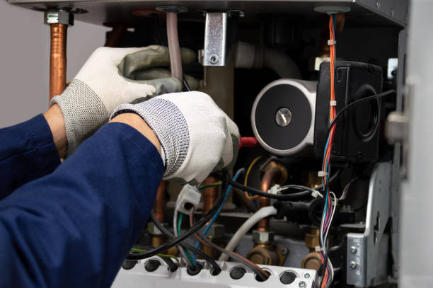 istock ale boiler technician repairing a water pump stuck 1278805733