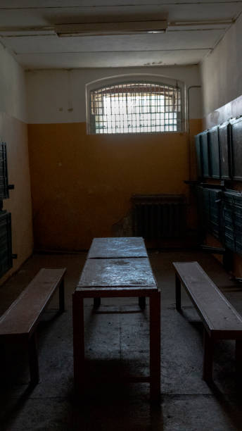 istock Light Coming in Through Prison Cell Bars Window. Empty Jail Cells. Prison Interior. Concept of Limiting Freedom. 1278805966