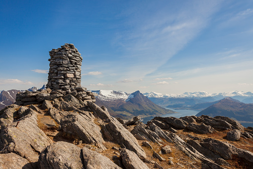 Cairn (a pile of stones) marking mountain hiking trail in Norway