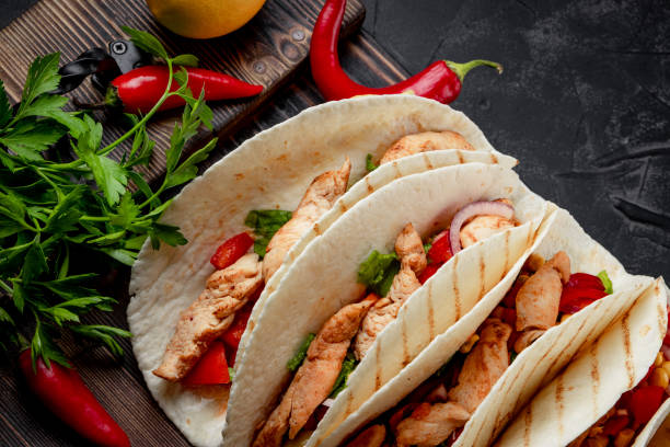 istock Mexican dish - tacos with chicken and corn close-up 1278808081