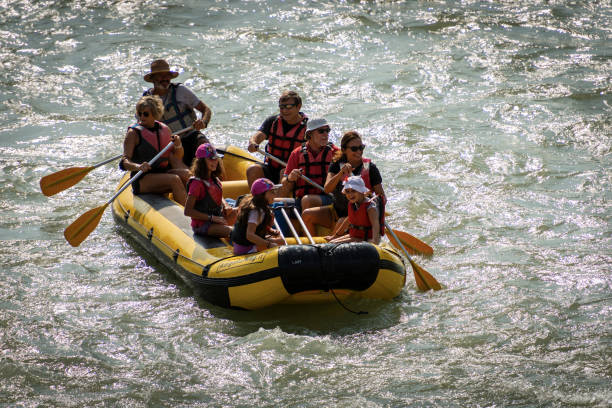 rafting on white water - river adige in verona downtown veneto italy - sports team sport rowing teamwork rafting imagens e fotografias de stock