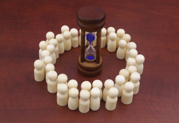 istock Many people surrounded hourglass, they want have extra time for life. 1278808549