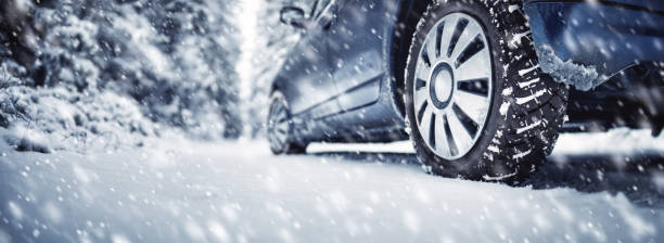 istock The car stopped on the roadside in a winter blizzard. 1278808671