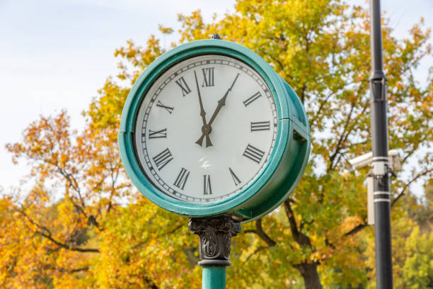 istock Big round clock in autumn park 1278809537