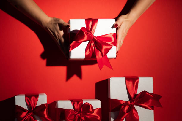 istock christmas gift holiday surprise hands present red 1278809596