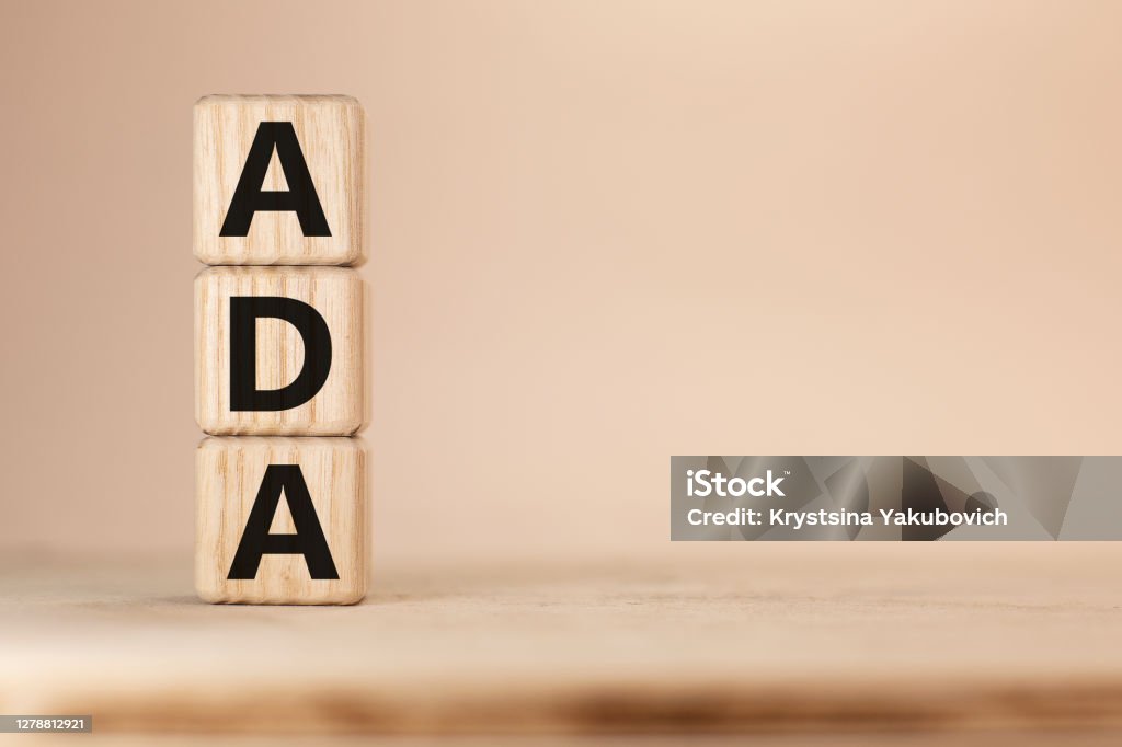 Word ADA Americans with Disabilities Acton wooden blocks beige background top view Word ADA on wooden blocks beige background top view Americans with Disabilities Act Stock Photo
