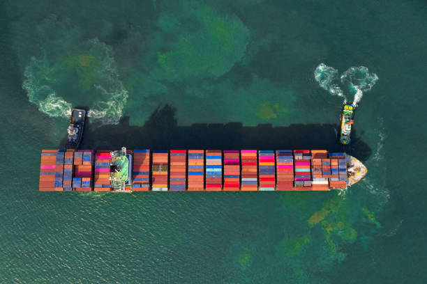 istock Container , container ship in export and import business and logistics. Shipping cargo to harbor by crane. Water transport International. Aerial view and top view. 1278818527