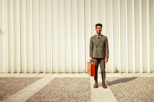 istock African American businessman with suitcase looking at camera 1278820038