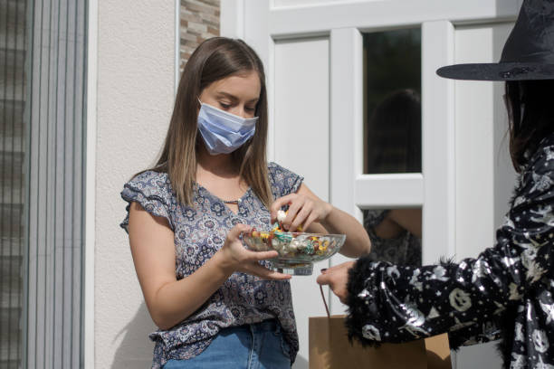 young woman in protective mask on halloween - 12 18 months imagens e fotografias de stock