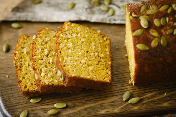 istock Gluten Free Pumpkin bread loaf set white cafe table background. 1278824325